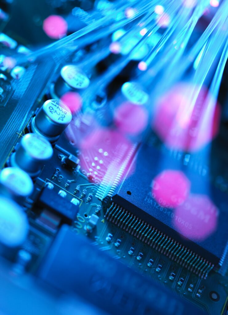 Fibre optics carrying data passing across electronic circuit board